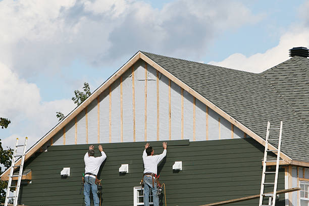 Professional Siding Contractor technician working in Chelsea, MA